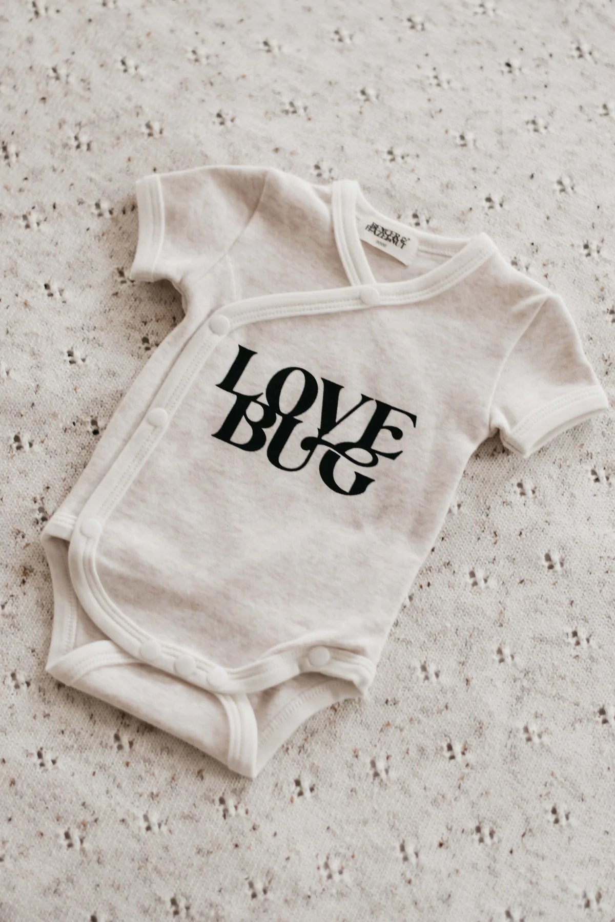 Love store bug onesie