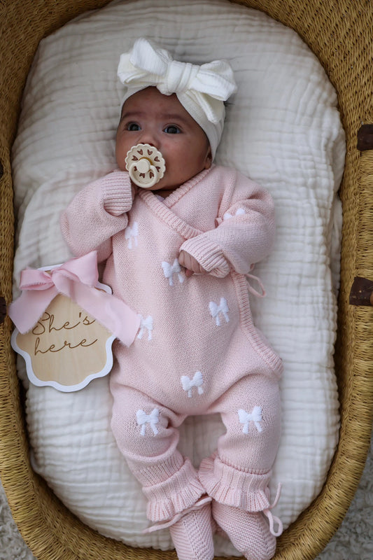 Petite + Co ‘She’s Here’ Pink Bow Plaque